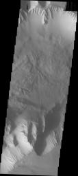 This image from NASA's Mars Odyssey shows part of Ius Chasma, the western end of the Valles Marineris system. In general there is more dust in the western region of Valles Marineris than anywhere else in the chasma system.