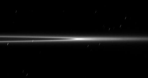 Seen from a viewpoint nearly coincident with the ringplane, the bright arc within the G ring appears even brighter with its ring material concentrated in the center of this image taken by NASA's Cassini spacecraft on Jan. 28, 2009.