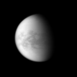 NASA's Cassini spacecraft examines the dark region of Senkyo on Saturn's largest moon, Titan. Senkyo is in the center of the image, and it lies just south of the moon's equator.