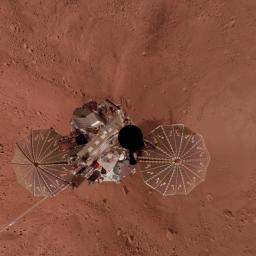 This view is a vertical projection that combines more than 500 exposures taken by NASA's Mars Phoenix Lander and projects them as if looking down from above. The black circle on the spacecraft is where the camera itself is mounted on the lander.
