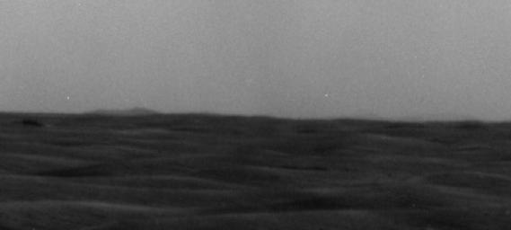 A western portion of Endeavour Crater is visible on the horizon of this image taken by NASA's Mars Exploration Rover Opportunity on March 7, 2009.