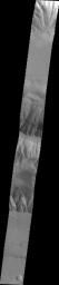 This 2001 Mars Odyssey spacecraft image crosses Coprates Chasma on Mars, showing both floor and wall features of the canyon.