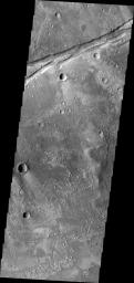 This 2001 Mars Odyssey spacecraft image shows a portion of the eastern end of Sirenum Fossae on Mars.