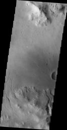 The channels in this image are draining the rim of an unnamed crater in Terra Sabaea on Mars as seen by NASA's Mars Odyssey spacecraft.
