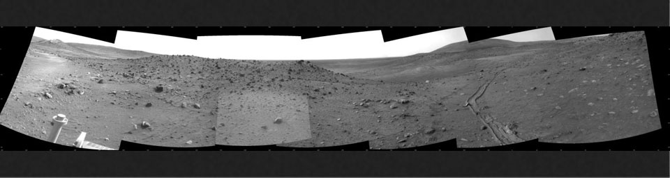 This scene combines seven frames taken by the navigation camera on NASA's Mars Exploration Rover Spirit during the 1,891st Martian day, or sol, of Spirit's mission on Mars (April 28, 2009).