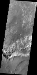 This image, taken by NASA's 2001 Mars Odyssey spacecraft, shows a large landslide deposit in an unnamed crater southwest of Holden Crater.