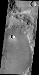 Dark slope streaks abound in this image taken by NASA's 2001 Mars Odyssey spacecraft. The unnamed craters in this image are located east of Henry Crater.