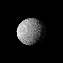 Appearing like a cyclops gazing off into space, Saturn's moon Mimas and its large Herschel Crater are profiled from NASA's Cassini spacecraft. Herschel Crater is 130 kilometers (80 miles) wide and covers most of the left of this image.