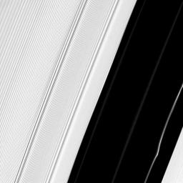 Several structures in Saturn's A ring are exposed near the Encke Gap in this image captured by NASA's Cassini spacecraft. A peculiar kink can be seen in one particularly bright ringlet at the bottom right.