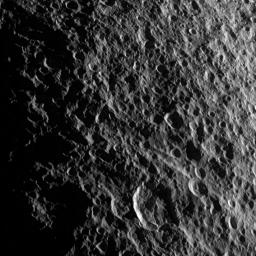 Geologic faults among craters on Saturn's moon Tethys are depicted in this image captured during a flyby of the moon by NASA's Cassini spacecraft on Aug. 14, 2010.