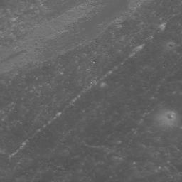 High-albedo marks on the lunar surface left by a boulder bouncing down the northeast wall of farside highlands crater Moore F in this image captured by NASA's Lunar Reconnaissance Orbiter.