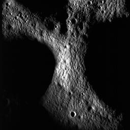 A junction between the rims of three craters on the floor of Peary crater near the lunar north pole is evident in this image taken by NASA's Lunar Reconnaissance Orbiter.