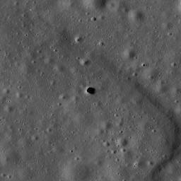 The Marius Hills pit is a possible skylight in a lava tube in an ancient volcanic region of the Moon called the Marius Hills. This image was taken by NASA's Lunar Reconnaissance Orbiter.