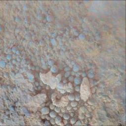 This image from the microscopic imager on NASA's Mars Exploration Rover Opportunity shows details of the coating on a rock called 'Chocolate Hills,' which the rover found and examined at the edge of a young crater called 'Concepcin.'