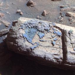 This false color image from the panoramic camera on NASA's Mars Exploration Rover Opportunity shows a rock called 'Chocolate Hills,' which the rover found and examined at the edge of a young crater called 'Concepcin.'