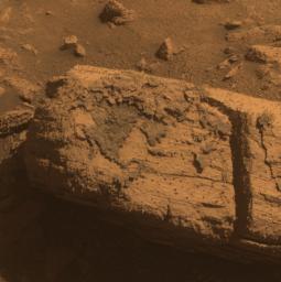This image from the panoramic camera on NASA's Mars Exploration Rover Opportunity shows a rock called 'Chocolate Hills,' which the rover found and examined at the edge of a young crater called 'Concepcin.'