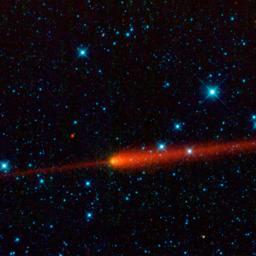 This image from NASA's Wide-field Infrared Survey Explorer features comet 65/P Gunn. Comets are balls of dust and ice left over from the formation of the solar system. The comet's tail is seen here in red trailing off to the right of the comet's nucleus.