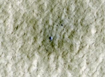 At the center of this view of an area of mid-latitude northern Mars, a fresh crater about 6 meters (20 feet) in diameter holds an exposure of bright material, blue in this false-color image observed by NASA's Mars Reconnaissance Orbiter.