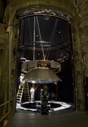 Testing of the cruise stage for NASA's Mars Science Laboratory in August 2010 included a session in a facility that simulates the environment found in interplanetary space. Spacecraft technicians at JPL prepare a space-simulation test.