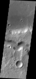 The wide channel in this image captured by NASA's Mars Odyssey is Tinto Vallis.