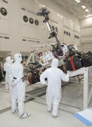 NASA's next Mars rover, Curiosity, stretches its robotic arm upward during tests on a tilt table in a clean room at NASA's Jet Propulsion Labotatory.