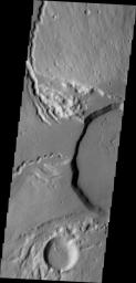 This image from NASA's Mars Odyssey shows part of the summit of Ceraunius Tholus.