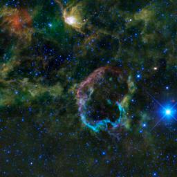 This oddly colorful nebula is the supernova remnant IC 443 as seen by NASA's Wide-field Infrared Survey Explorer; the Jellyfish nebula is particularly interesting because it provides a look into how stellar explosions interact with their environment.