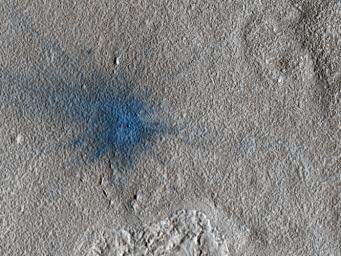 This image from NASA's Mars Reconnaissance Orbiter shows an approximately 7-meter diameter fresh crater and dark ejecta blanket. These small impact craters continue to form on Mars, and are most easily recognized in areas covered by bright dust.