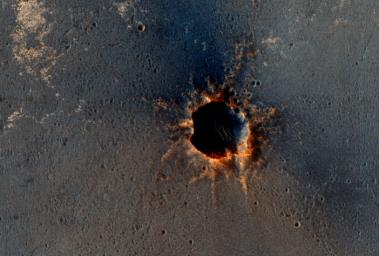 NASA's Mars Reconnaissance Orbiter acquired this color image on March 9, 2011, of 'Santa Maria' crater, showing NASA's Mars Exploration Rover Opportunity perched on the southeast rim. The rover is the bluish speck on the crater rim (arrow).