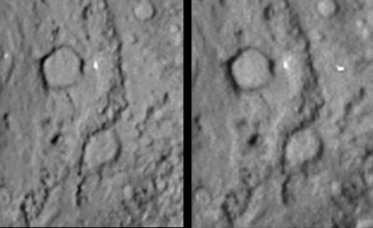 Reversed stereo image pair covering the region of NASA's Deep Impact site from the Stardust-NExT mission on comet Tempel 1. A large crater is seen at the top of the image.
