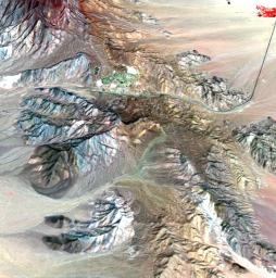 This image of the Mountain Pass rare open-pit earth mine was acquired by NASA's Terra spacecraft in southeastern California near the Nevada border.