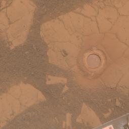 NASA's Mars Exploration Rover Opportunity used its rock abrasion tool on a rock informally named 'Gagarin.' This approximately true color image shows the circular mark created where the tool exposed the interior of the rock at a target called 'Yuri.'