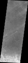 The windstreaks in this image captured by NASA's Mars Odyssey are located on the plains of southern Syrtis Major Planum.