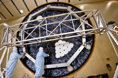 Technicians at Lockheed Martin Space Systems, Denver, prepare the heat shield for NASA's Mars Science Laboratory. With a diameter of 4.5 meters (nearly 15 feet), this heat shield is the largest ever built for a planetary mission.