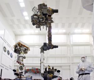 This photograph of the NASA Mars Science Laboratory rover, Curiosity, was taken during testing on June 3, 2011. The turret at the end of Curiosity's robotic arm holds five devices. In this view, the drill is at the six o'clock position.