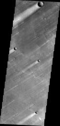 The windstreaks in this image of Syrtis Major Planum indicate winds blowing from the northeast. This image is from NASA's 2001 Mars Odyssey spacecraft.