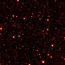 Asteroid 2010 TK7, the first known Earth Trojan asteroid, is circled in green, in this single frame taken by NASA's Wide-field Infrared Survey Explorer. The majority of the other dots are stars or galaxies far beyond our solar system. 