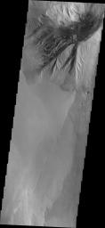 This image from NASA's 2001 Mars Odyssey spacecraft shows the northern margin of Beatis Mensa, a large mound of material in the center of Ophir Chasma.