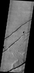 Sirenum Fossae is comprised of long, parallel fracture systems, some of which are seen in this image from NASA's 2001 Mars Odyssey spacecraft.