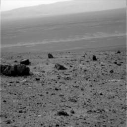 The large rock on the left in the foreground, informally named 'Tisdale 1.' It is part of a group of rocks that appear to have been ejected by the excavation of Odyssey crater on the rim of Endeavour crater by NASA's Mars rover Odyssey.