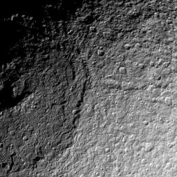 NASA's Cassini spacecraft takes a detailed look at the northern part of the huge Odysseus Crater on Saturn's moon Tethys. The crater dominates the left half of this view of Tethys.