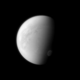 Titan's swirling south-polar vortex stands out brightly against the other clouds of the south pole (lower right) in this image captured by NASA's Cassini spacecraft.