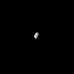 NASA's Cassini spacecraft catches a glimpse of Janus, an irregularly shaped moon. Lacking sufficient gravity to pull itself into a round shape, Janus has had its lumpy primordial shape only slightly modified by impacts since its formation.