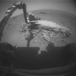 NASA's Mars Exploration Rover Opportunity used its front hazard-avoidance camera to take this picture showing the rover's arm extended toward a light-toned rock, 'Tisdale 2,' during sol 2,695 (Aug. 23, 2011). Tisdale 2 is about 12 inches tall.