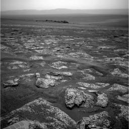 This image from the navigation camera on NASA's Mars Exploration Rover Opportunity shows the view ahead on the day before the rover reached the rim of Endeavour crater. It was taken during the 2,680th Martian day, or sol, of the rover's work on Mars.