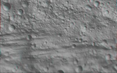 This anaglyph image shows the topography of part of Vesta's equatorial region; this uneven topography is mostly due to large, ancient, rather degraded ruin eroded craters. You need 3D glasses to view this image.