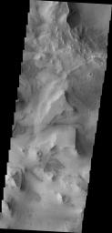 This image from NASA's 2001 Mars Odyssey shows the mesas and mountain tops of Capri Chasma.
