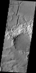 This image from NASA's 2001 Mars Odyssey spacecraft shows evidence of tectonic stresses that deform and fracture rocks and planetary surfaces. Right angles seen here are a good indication that the feature was formed by tectonic stresses.