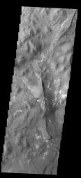 This image from NASA's 2001 Mars Odyssey spacecraft shows a portion of Aureum Chaos. Several layers of material are visible in the image.