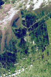 On Oct. 25, 2011, the Chao Phraya River was in flood stage as NASA's Terra spacecraft imaged flooded agricultural fields and villages depicted here in dark blue, and the sediment-laden water in shades of tan.
